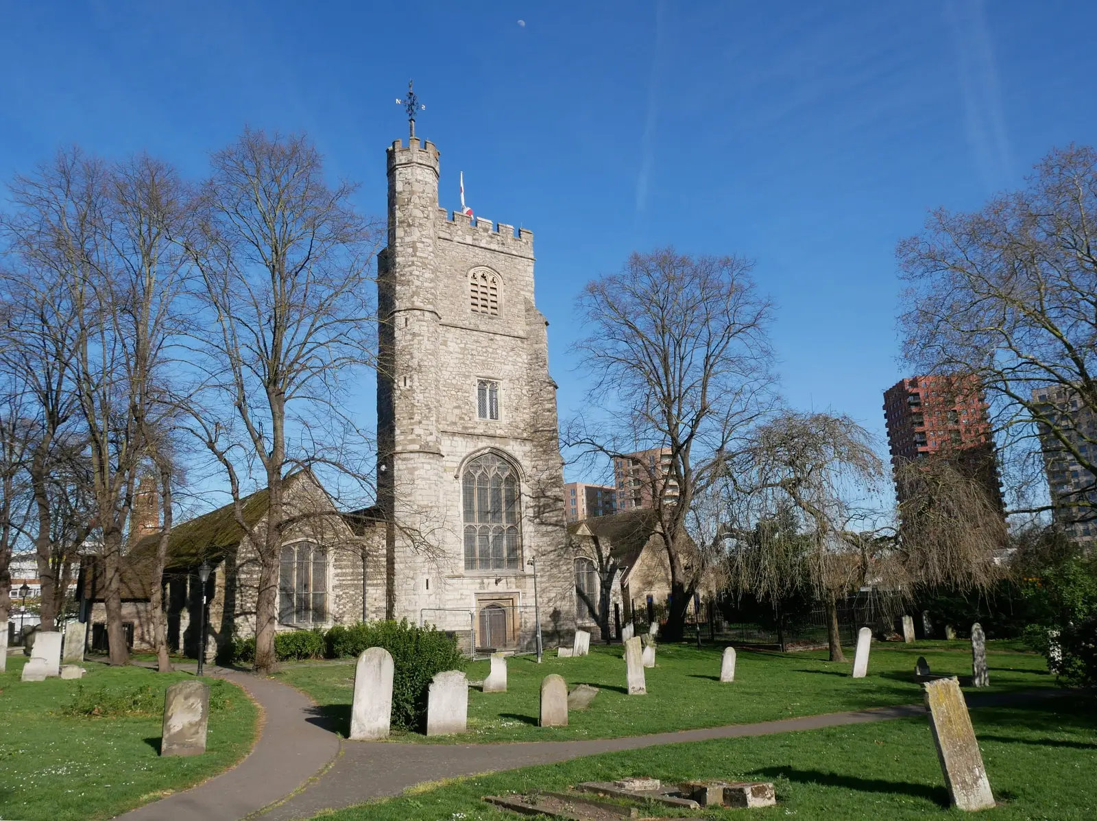 The stone west tower of St Margaret’s Church in Barking under a blue sky