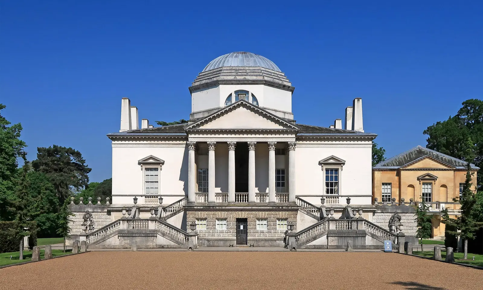 Chiswick House, a white Palladian villa, seen across its lawn