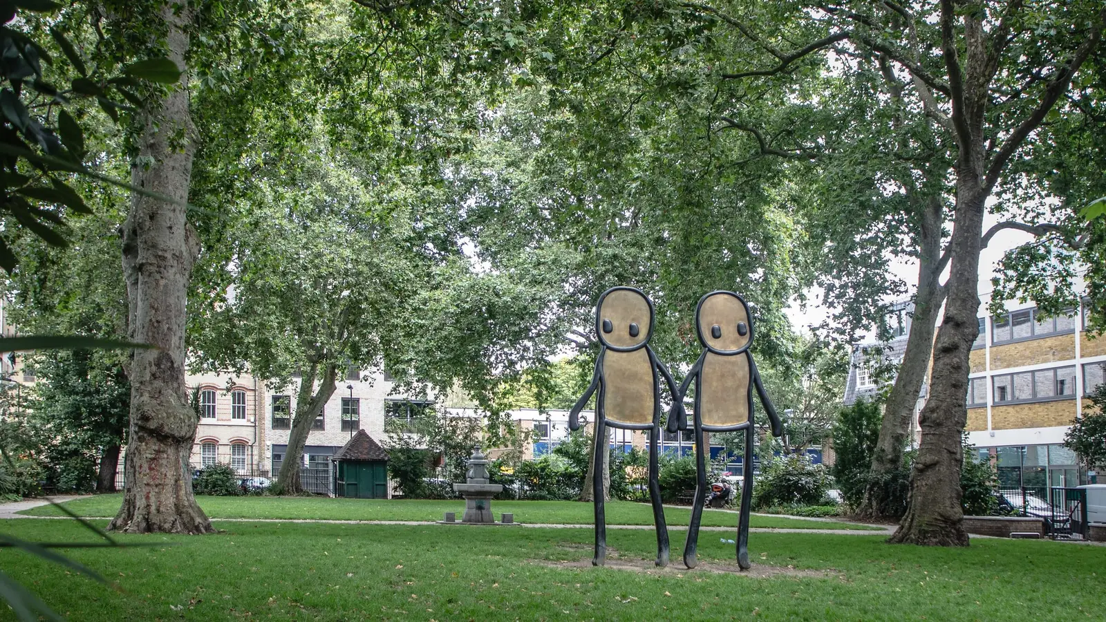Hoxton Square’s plane trees and a tall public sculpture of two figures holding hands