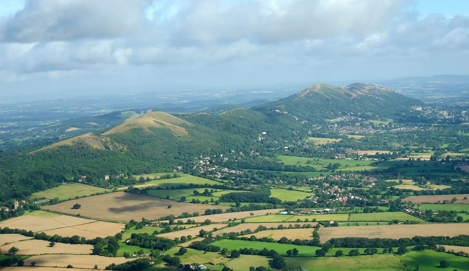 The Malvern Hills rising above a patchwork of fields