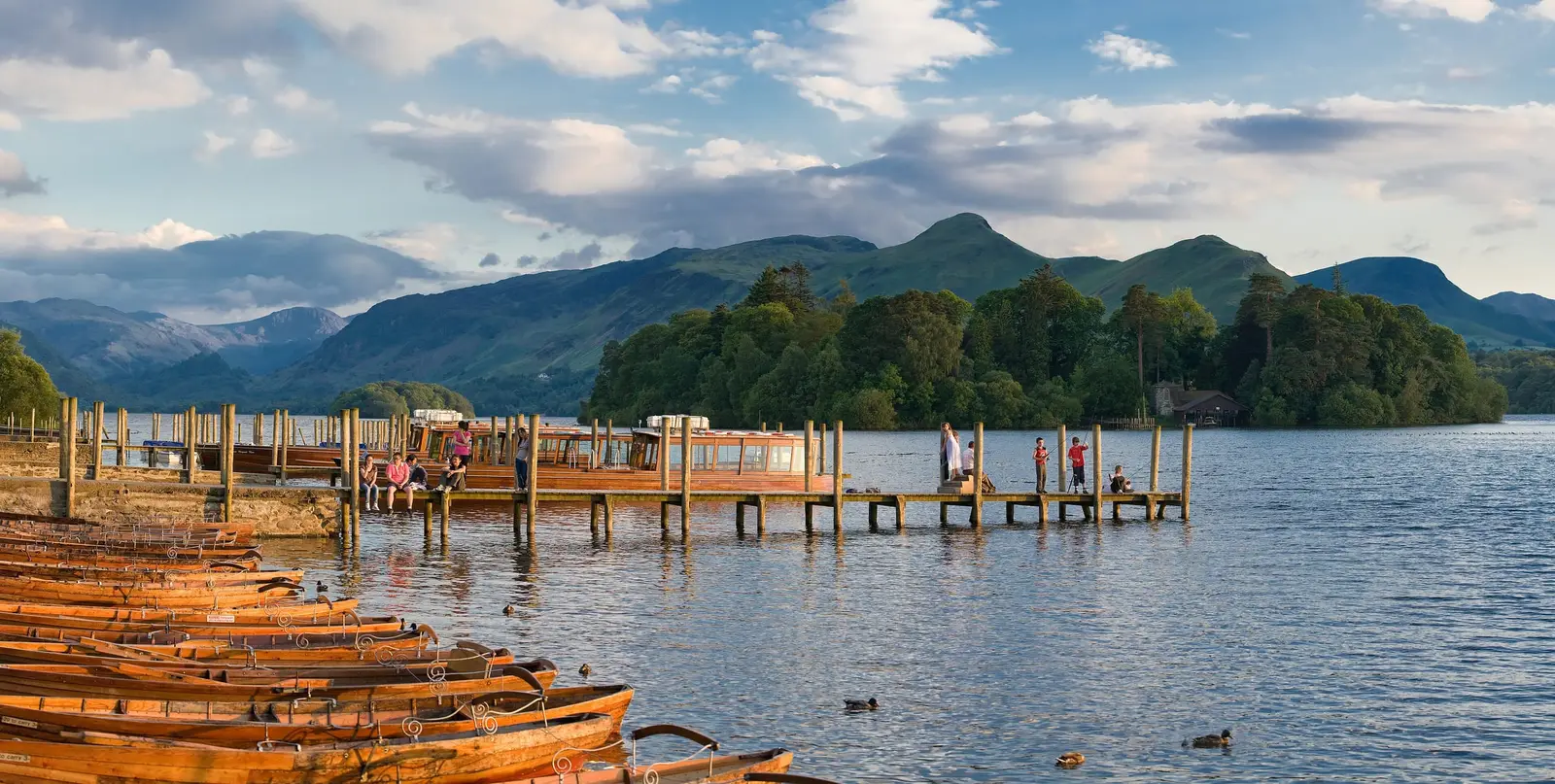 The wooden pier and rowing boats on Derwentwater near Keswick