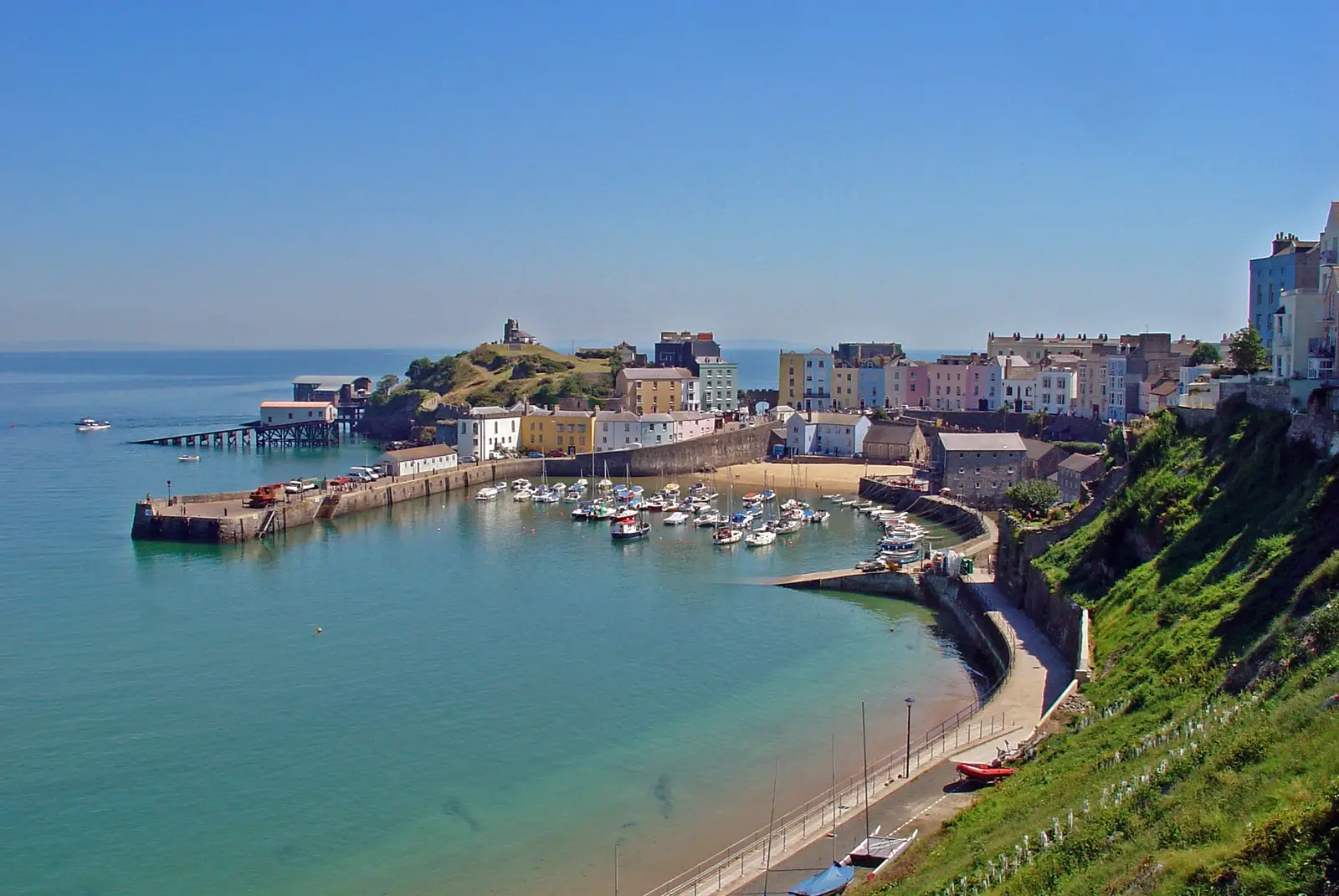 Colourful houses above Tenby harbour and its boats