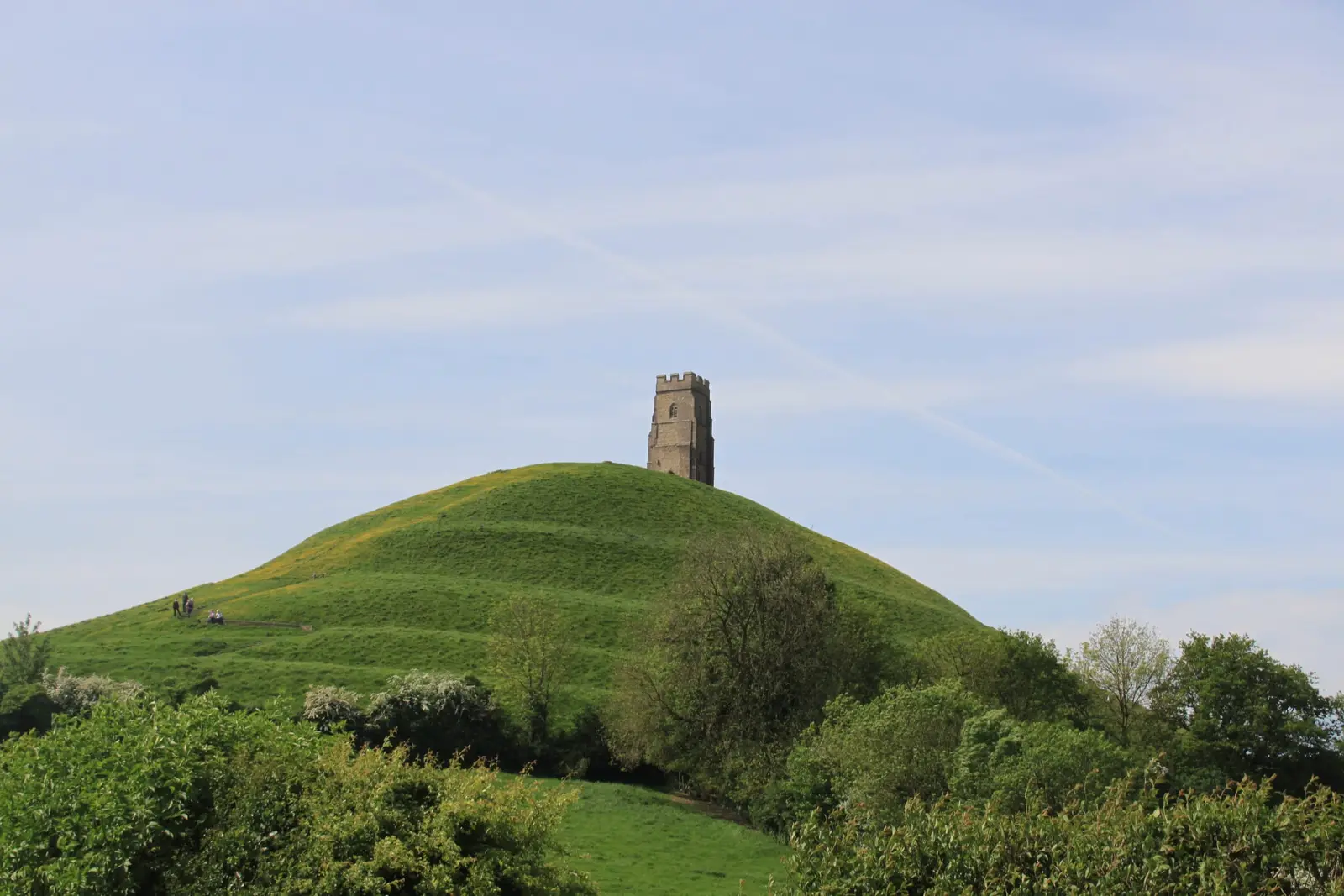 Glastonbury Tor and its terraced slopes rising above the Somerset Levels