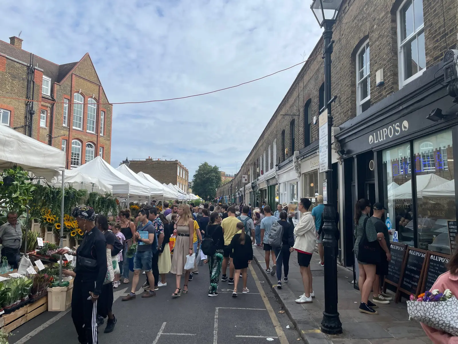 Columbia Road Flower Market busy with shoppers and flower stalls