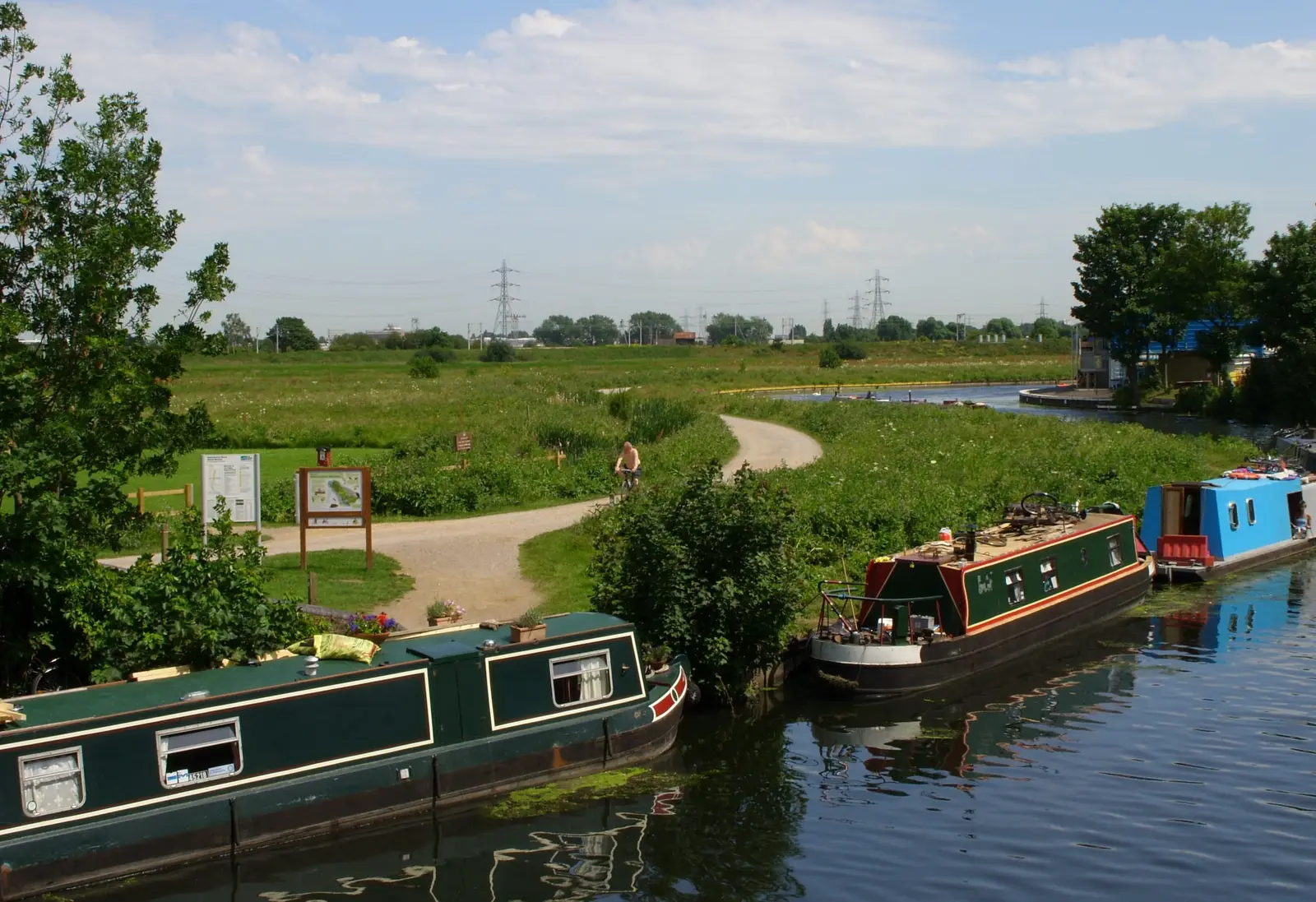 Narrowboats moored on the River Lea beside Walthamstow Marshes